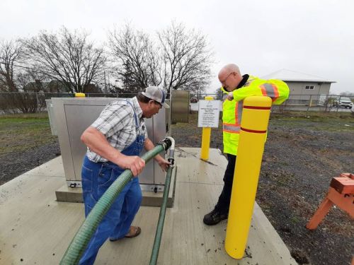 Photo from left to right: Local farmers D’Arcy and Jason Snider were one of the first to fill up at the new bulk water filling station in Sydenham as Troy Dunlop, Manager of Engineering and Capital Projects looks on.
